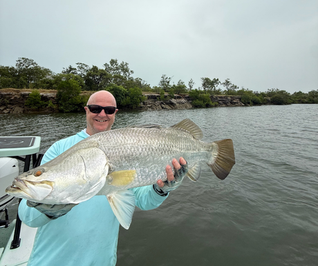 Cairns Tackle World Manger Rob Erskine with one of several quality barramundis caught in the Gulf last week.